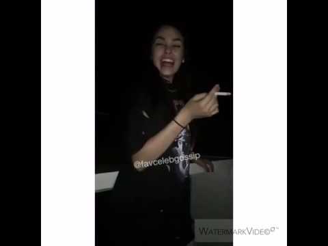Maggie Lindemann smoking a cigarette